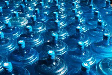 Rows of large blue water storage containers used for long-term emergency water supply